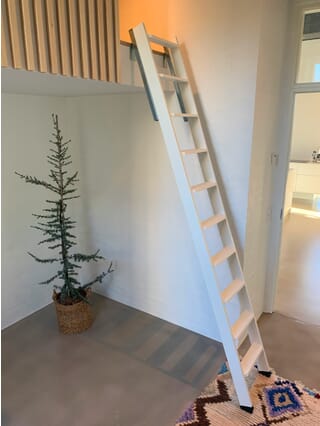 Dolle Straight Flight Wooden Loft Ladder (White) being used with a Ladder Slide System